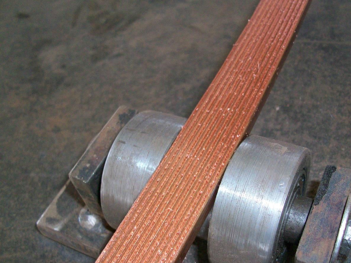 Copper strip running through the forming rolls